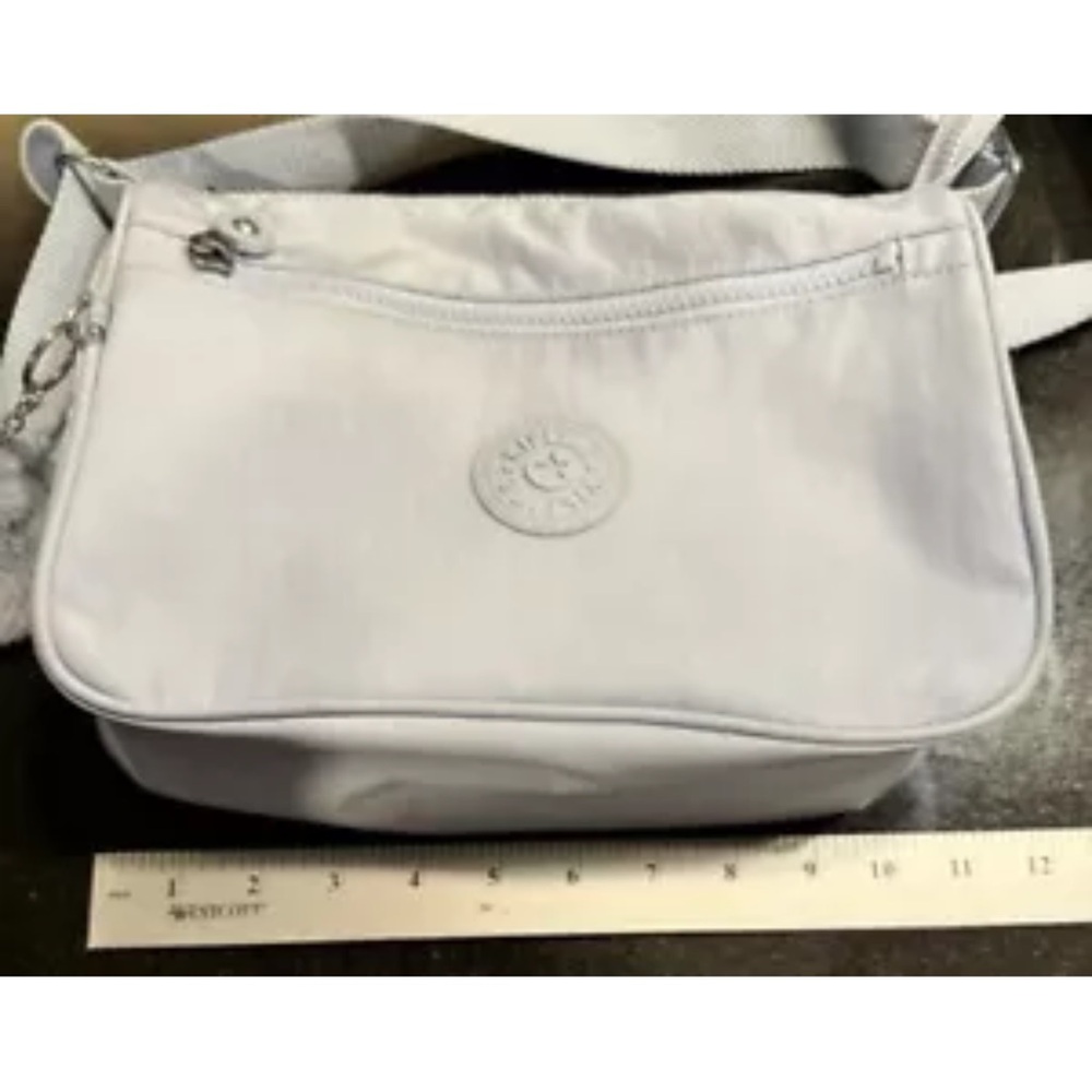beautiful blue The bag measures 10.5" in width, 7.5" in height, and 4" in depth